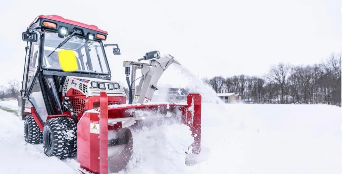 Tracked snow blower unit clearing deep snow
